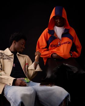 Two men showcasing bold urban streetwear styles with vibrant colors and unique designs.