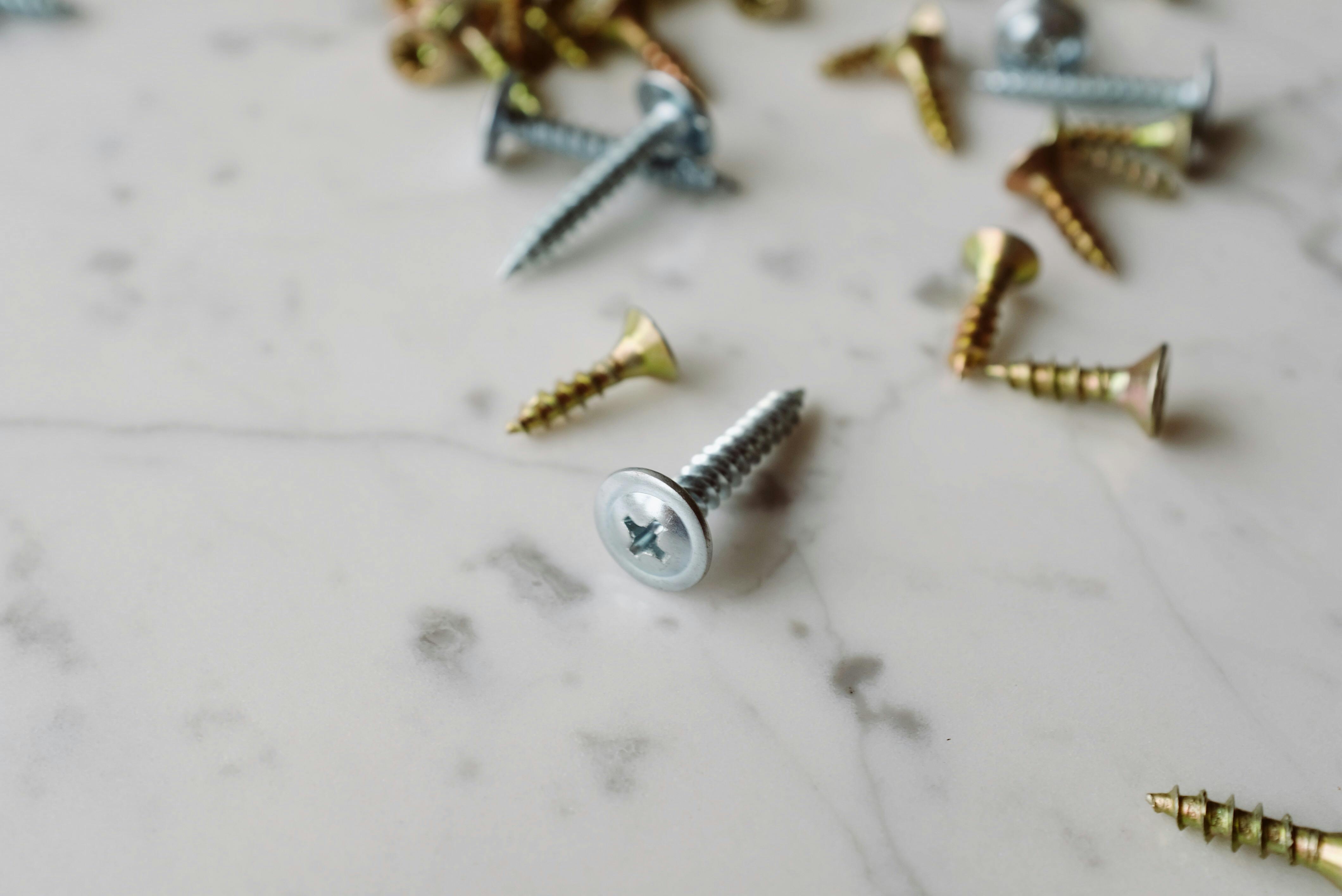 Silver And Gold Screws · Free Stock Photo