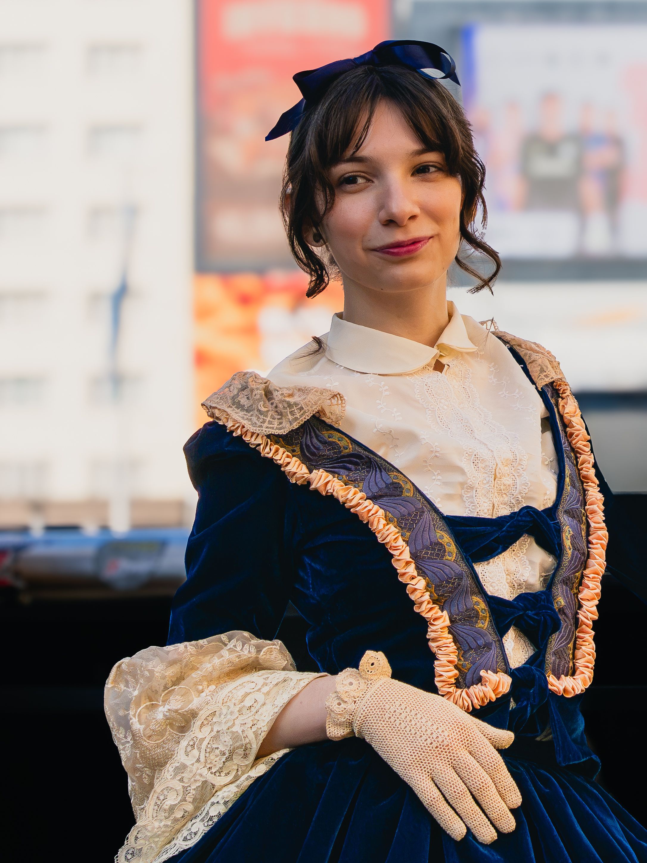 A woman in historical attire poses in Buenos Aires, Argentina during the day.