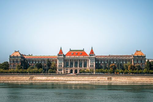 Free Scenic view of Budapest University building on a sunny day with river reflection. Stock Photo