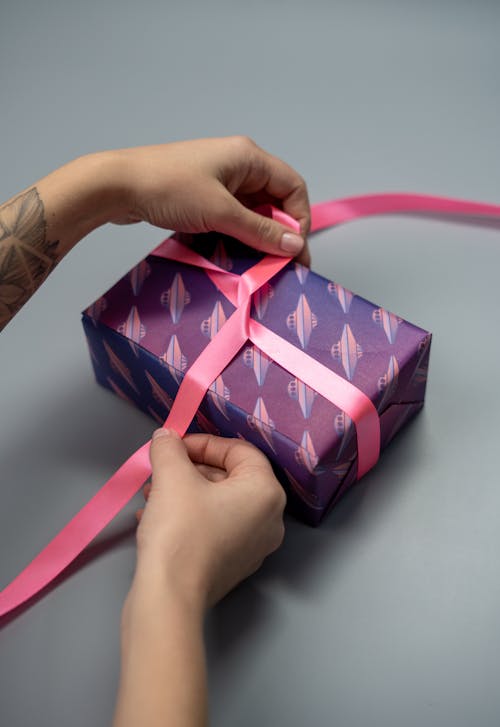 Free Person Wrapping A Gift Stock Photo