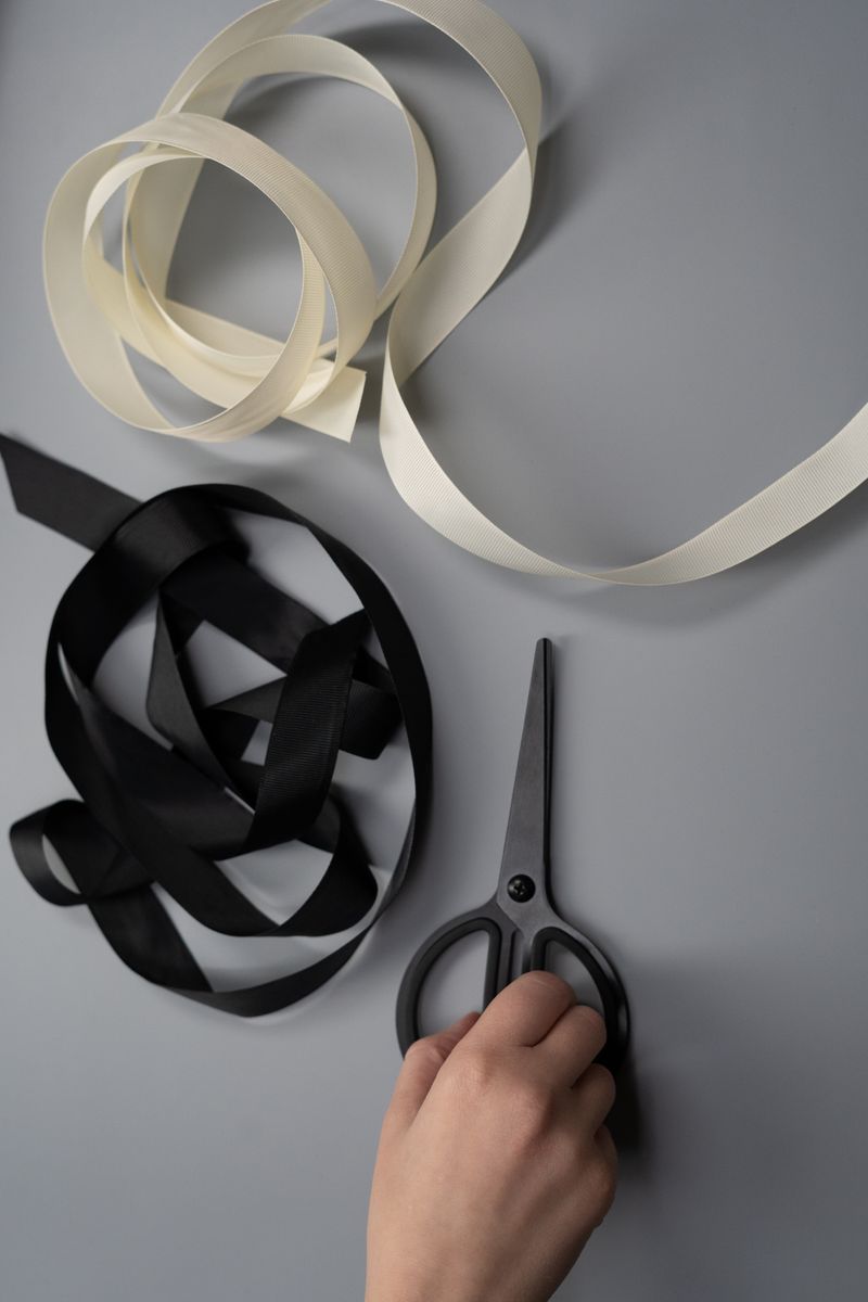 Scissors and ribbons laid out on a craft table