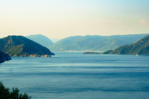 Free Serene view of Marmaris Bay surrounded by lush green mountains under a clear sky. Stock Photo