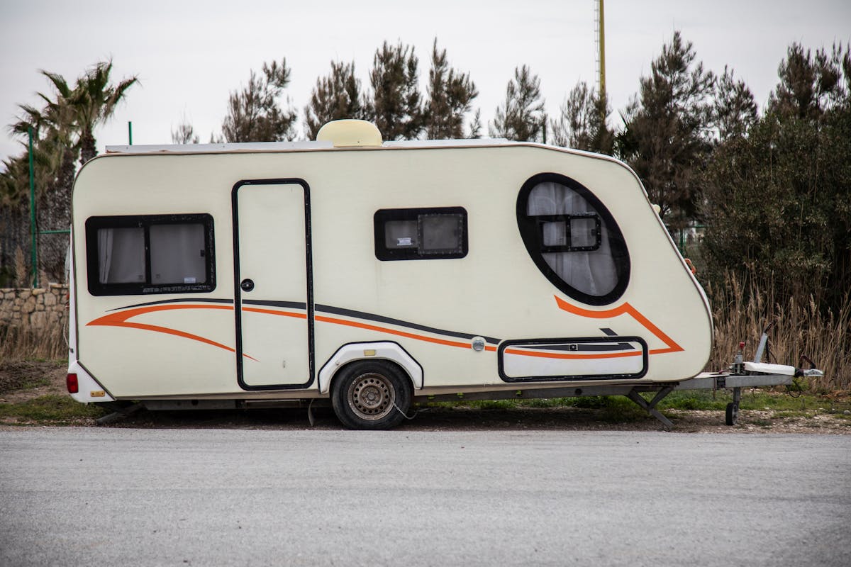 Modern travel trailer caravan parked outdoors ready for pre-trip inspection before a camping adventure