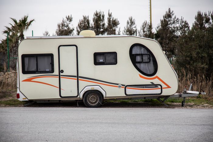 White travel trailer parked