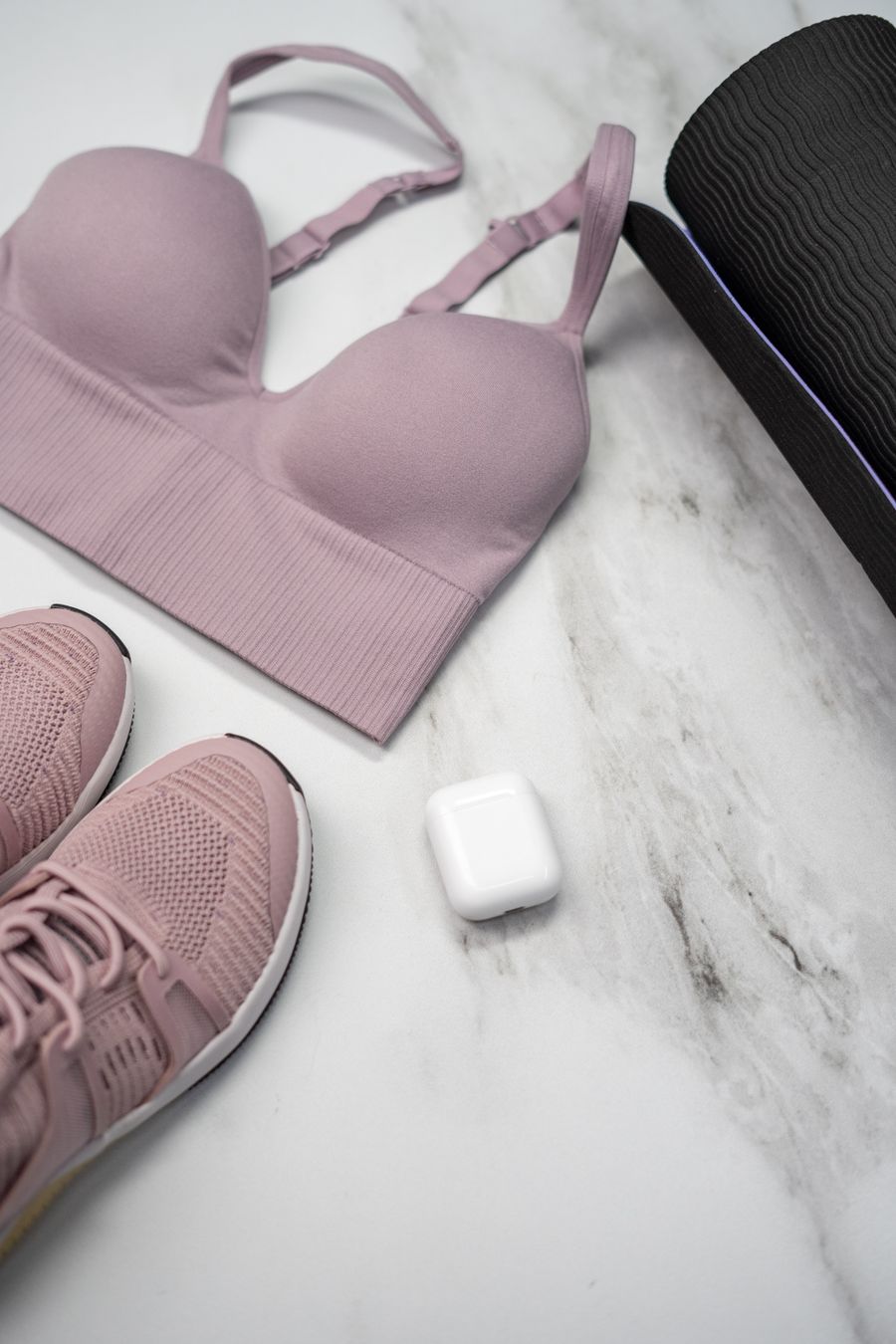 Puma supportive sports bra in pastel pink laid flat