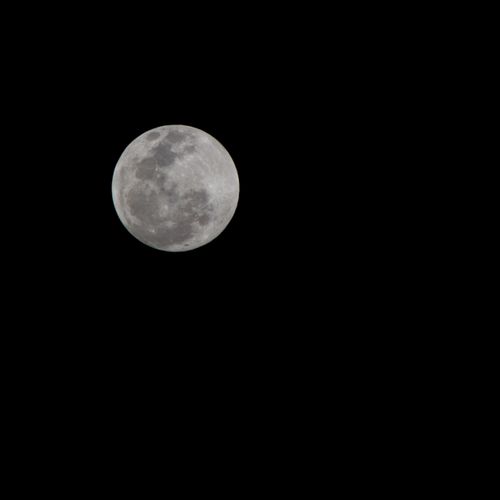 Free Stunning capture of the full moon in the clear night sky over Roodepoort, South Africa. Stock Photo