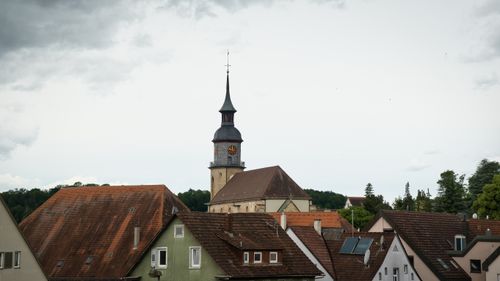 Free A picturesque church tower rises above traditional German rooftops in Vaihingen an der Enz. Stock Photo