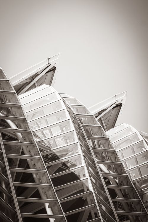 Free Abstract view of a modern architectural design with glass and metal elements in sepia tone. Stock Photo