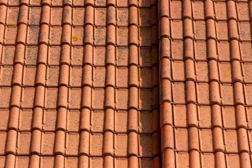 Free Close-up image showing classic terracotta roof tiles arranged in neat rows. Stock Photo