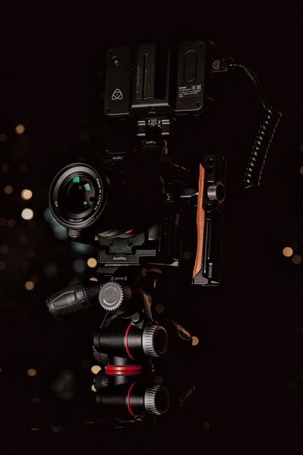 Close-up shot of high-end video camera equipment with bokeh background, perfect for film or photography themes.