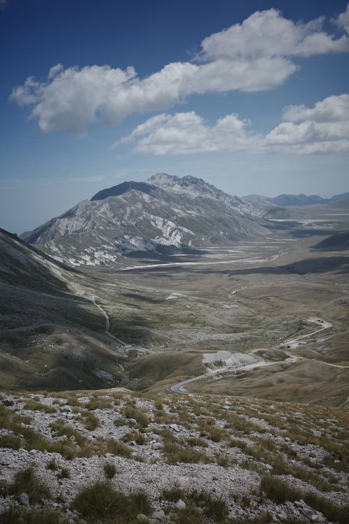 Free Breathtaking landscape of Gran Sasso Mountains under a blue sky in Abruzzo, Italy. Stock Photo