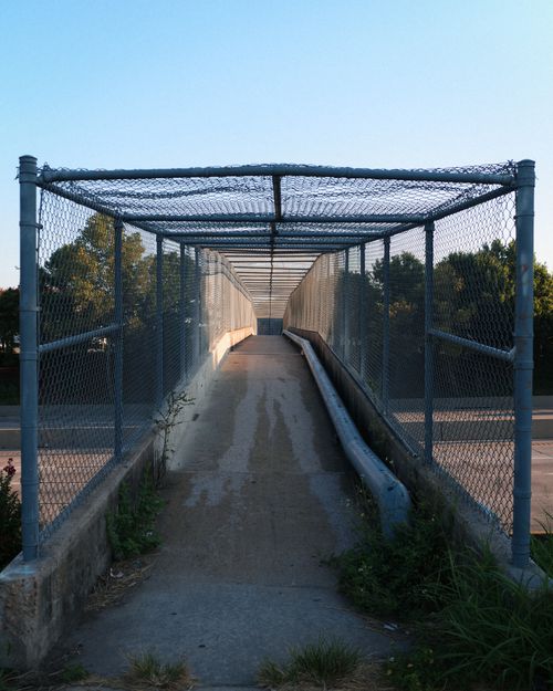 Free Photo of a pedestrian footbridge in Houston, TX during sunset with clear skies. Stock Photo