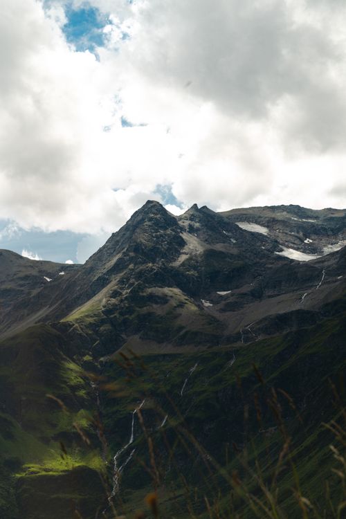 Free Captivating view of the peaks of Bad Gastein, Austria under a dramatic sky. Stock Photo