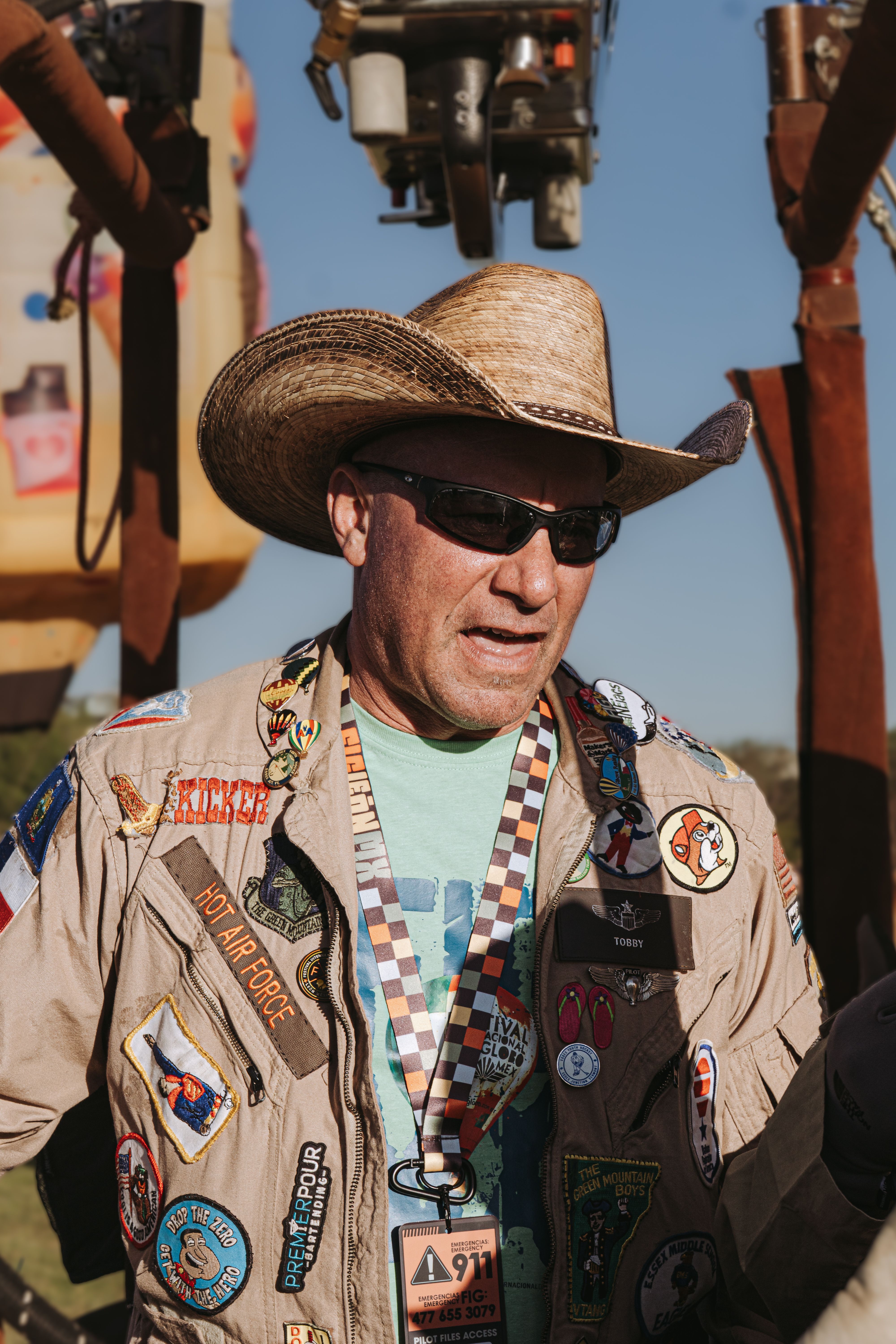 A cowboy hat-wearing enthusiast at a hot air balloon festival in Guanajuato, Mexico.
