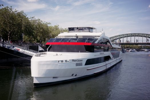 Rhein Galaxie cruise ship docked on the Rhine River in Cologne, showcasing scenic views and architecture.