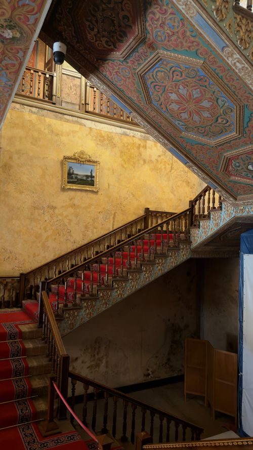Free Intricately designed staircase with vibrant red carpet in a historic Turkish mansion. Stock Photo