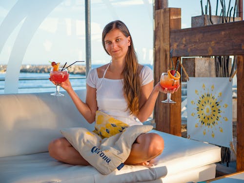 Woman Holding Wine Glasses