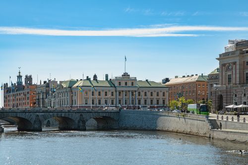 Free Beautiful daytime view of historic buildings and a bridge in Stockholm, Sweden along a river. Stock Photo