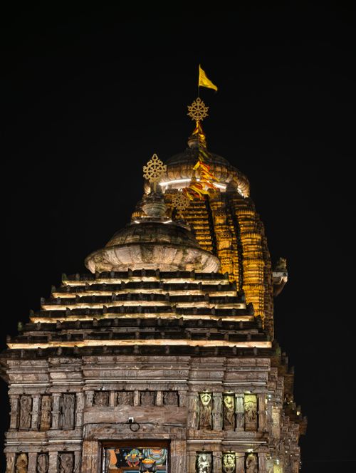 Free Elegant night view of an ancient temple's architecture, beautifully lit against the dark sky. Stock Photo