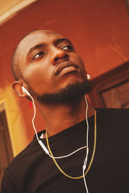 Free Confident African man with earphones and beard in Lagos, Nigeria. Stock Photo