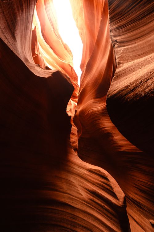 Free Sunlight filters through the narrow, swirling rock formations of Antelope Canyon, Arizona. Stock Photo