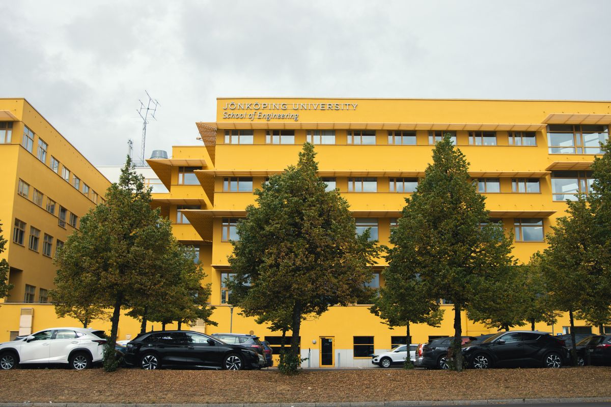 University campus building representing research versus coursework focus