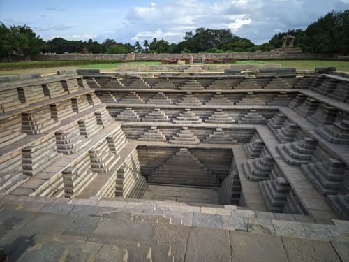 Free Explore the intricate architecture of an ancient stepwell in Hampi, India, showcasing geometric design and history. Stock Photo