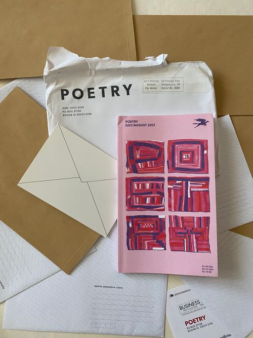 Free Flat lay photo featuring Poetry magazine with envelopes and papers on a table. Stock Photo