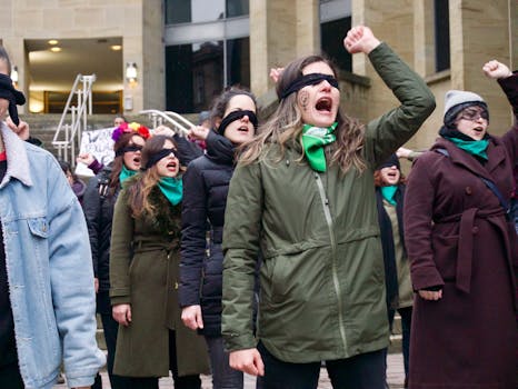 A dynamic group of women protesting for feminism and justice in Glasgow, Scotland.