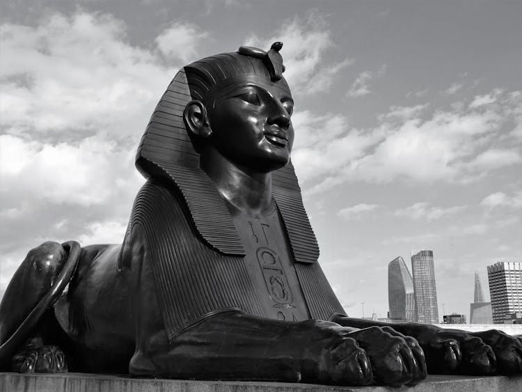 Sphinx Statue Near Modern City