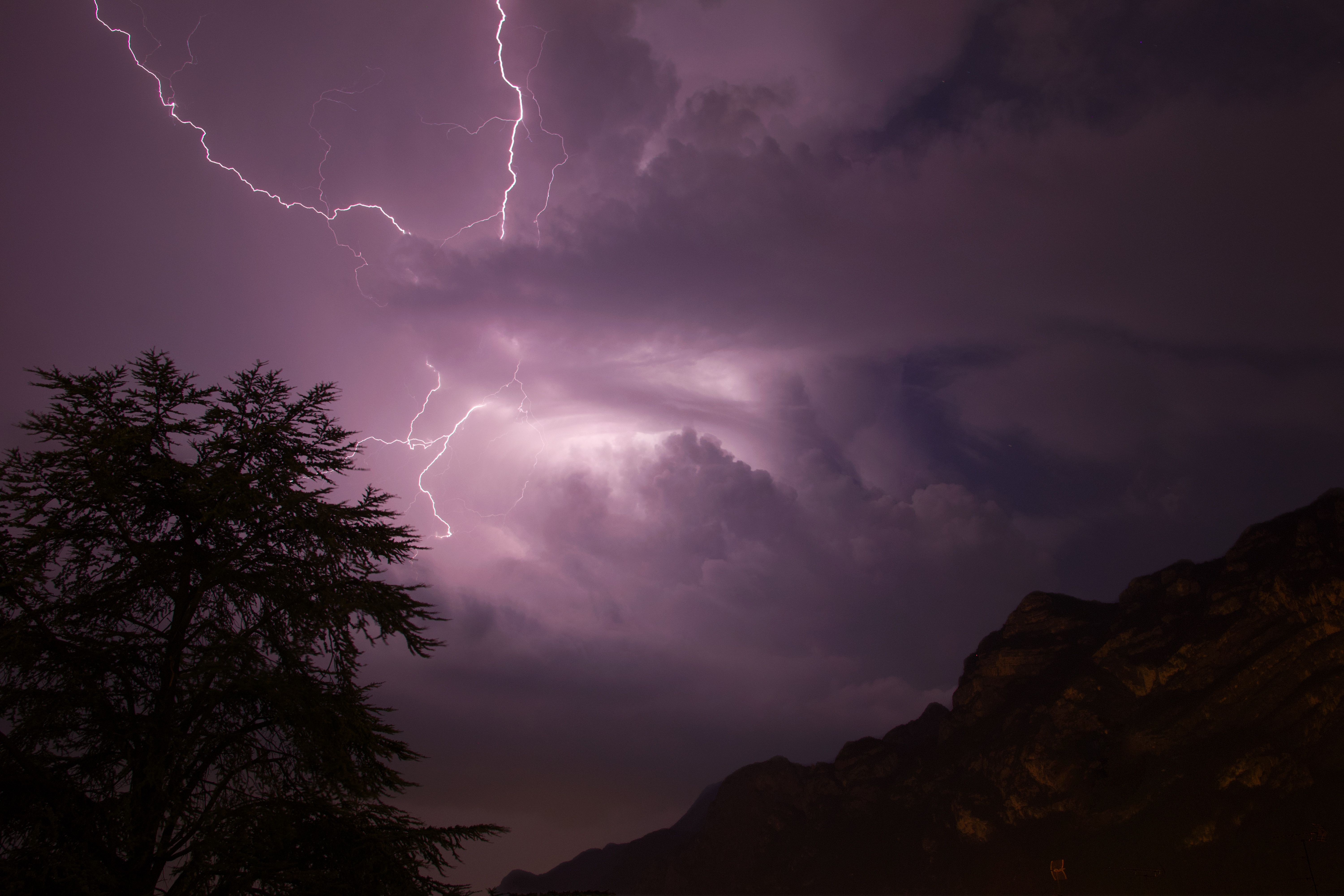 Stunning night shot of a lightning storm over mountains in Italy.