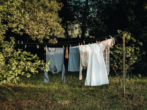 Clothes hanging on a line amidst nature in Provence-Alpes-Côte d'Azur, France.