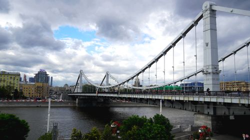 Free Scenic view of Krymsky Bridge in Moscow under a cloudy sky with urban background. Stock Photo