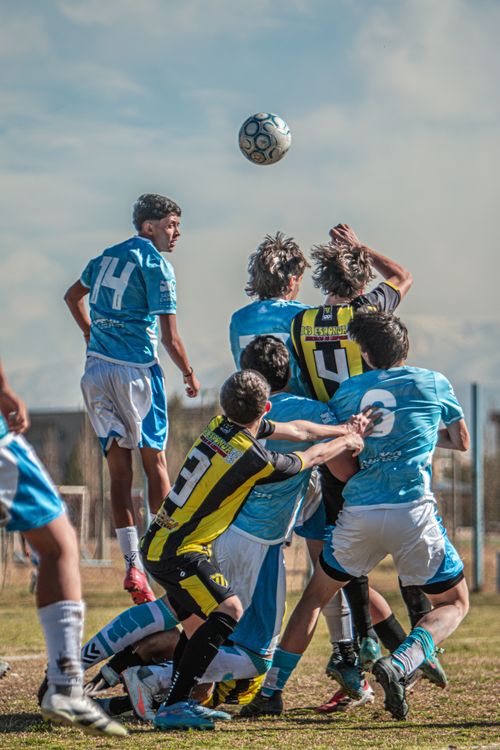 Free Energetic youth soccer players in action during a competitive outdoor match. Stock Photo