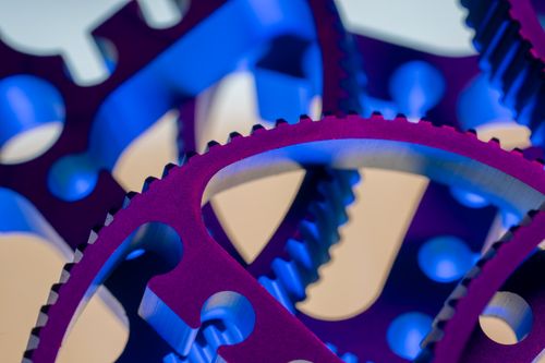 Free Vibrant macro photograph of interlocking metal gears showcasing precision engineering. Stock Photo