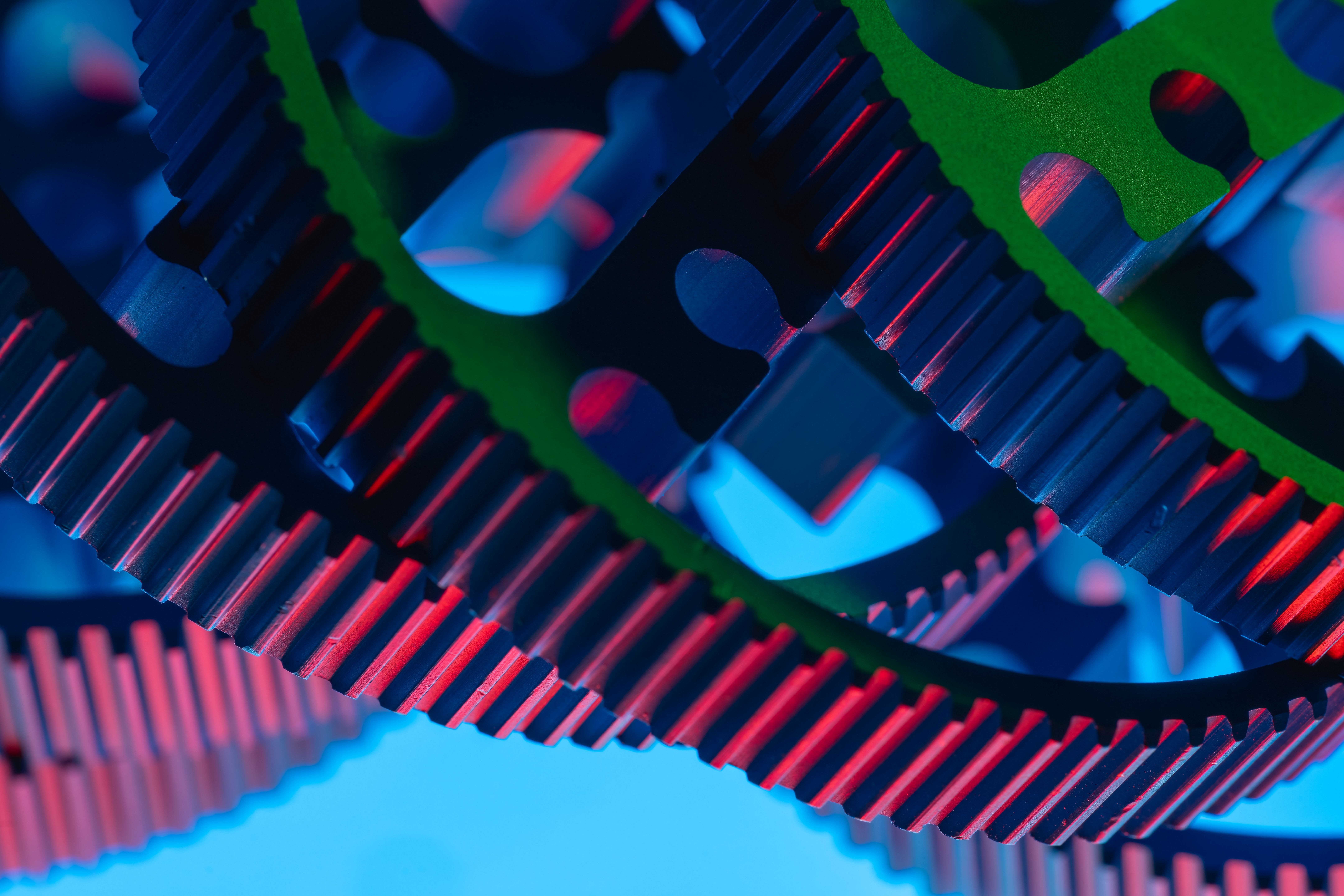 Vibrant macro shot of colorful gears illustrating precision engineering and industrial technology.