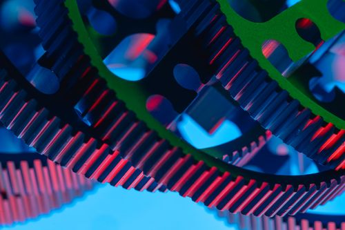 Free Vibrant macro shot of colorful gears illustrating precision engineering and industrial technology. Stock Photo