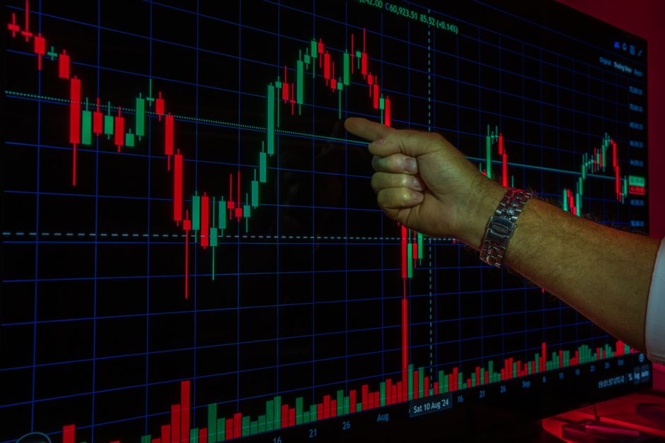 Photo by Rafael Minguet Delgado on Pexels A hand analyzing a financial graph on a digital screen, highlighting stock market trends and data.