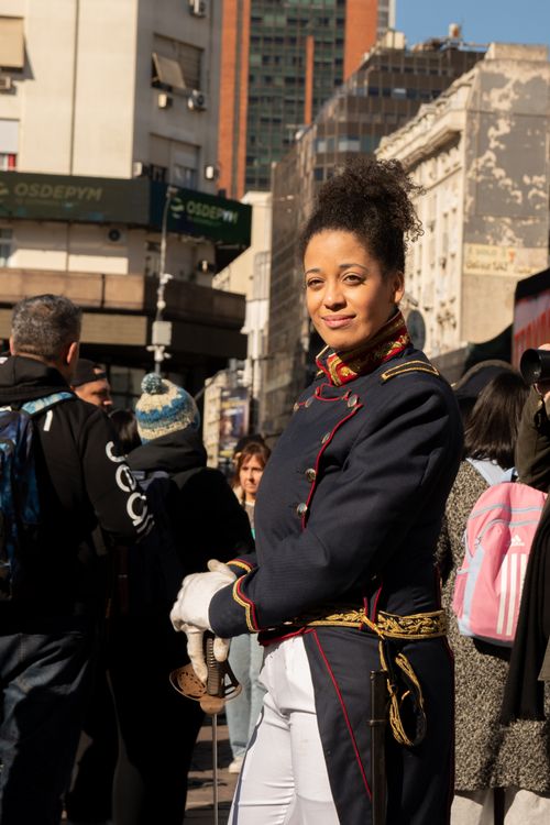 Free Woman in historical uniform performing outdoors in city street. Stock Photo