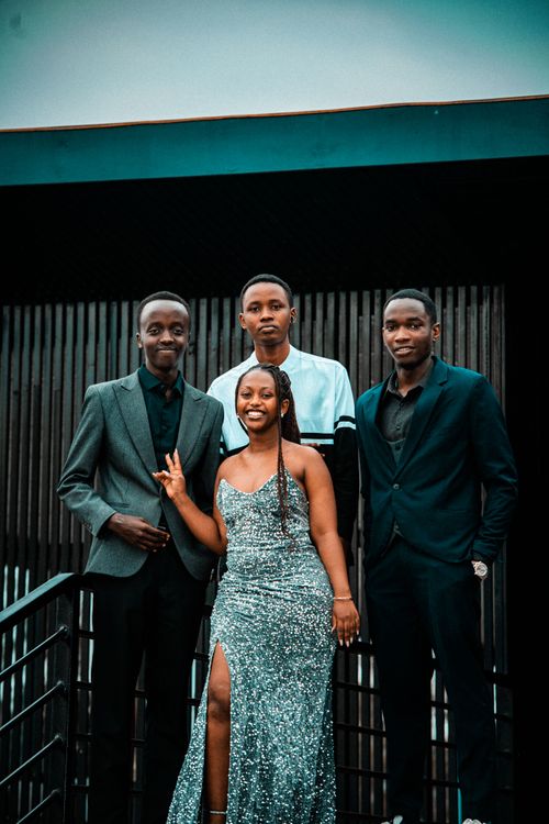 Free Group of young adults dressed formally, posing outdoors in Rwanda. Stock Photo