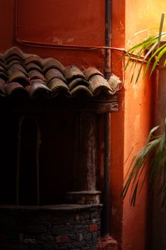 Warm terra cotta tones in a rustic Lugano courtyard create a cozy, inviting atmosphere.