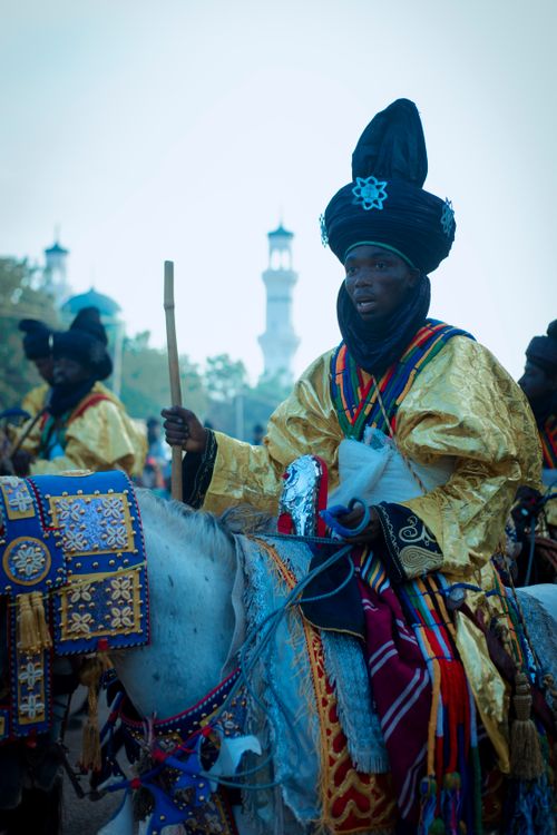 Free Vibrant cultural parade featuring mounted riders in traditional attire with ornate costumes. Stock Photo