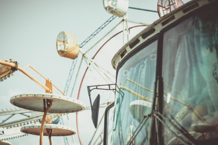 Bus Parked Against Ferris Wheel