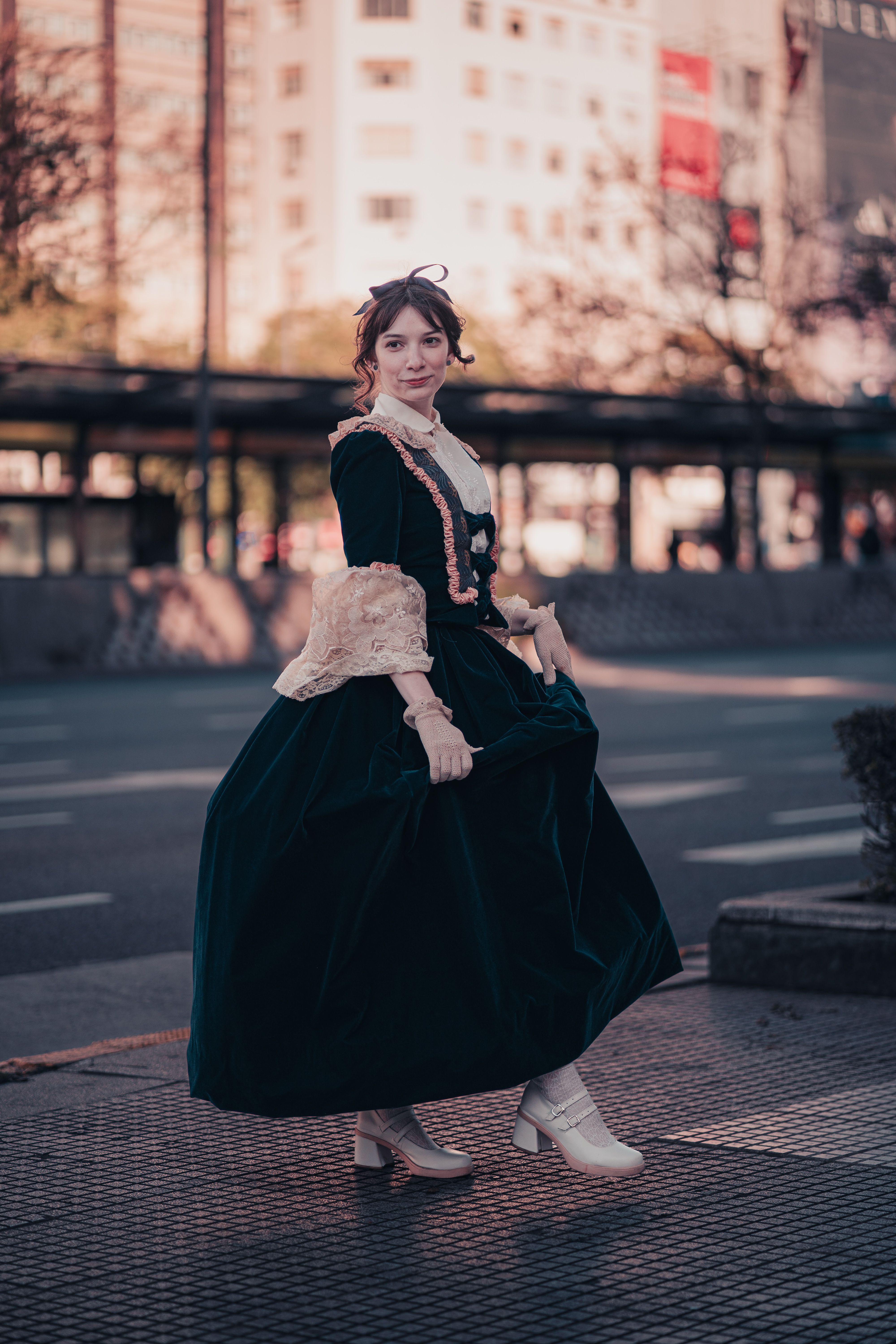 Woman in period costume on Buenos Aires street during daytime.