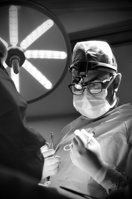 A clinical illustration of a partial hysterectomy procedure performed by a surgeon.
