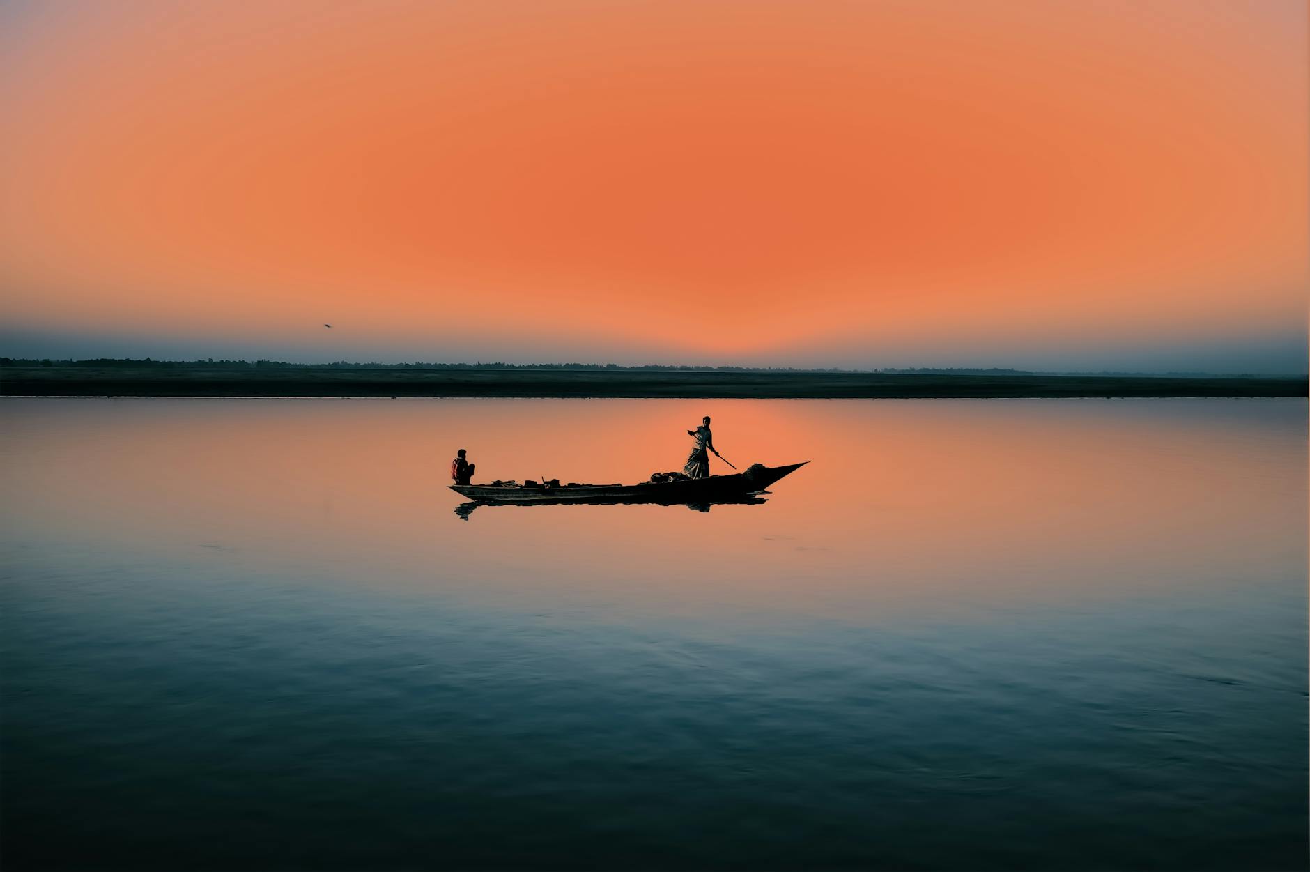 https://www.pexels.com/photo/people-riding-on-boat-during-sunset-3930012/