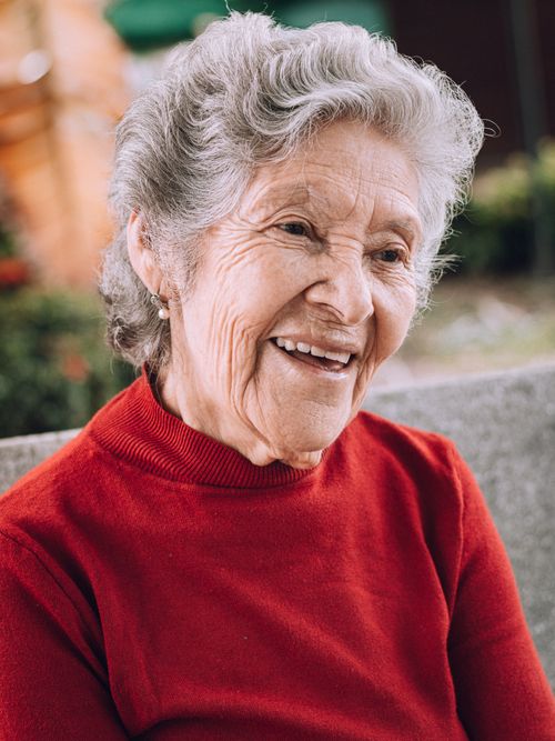 Free Portrait of a cheerful elderly woman with a warm smile, captured outdoors in Gigante, Huila, Colombia. Stock Photo