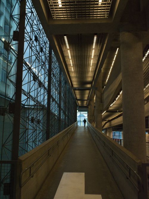 Free Wide-angle view of modern architecture with a single person silhouetted. São Paulo, Brazil. Stock Photo