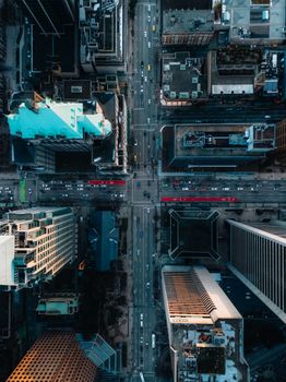 A dramatic aerial shot of a bustling intersection in downtown Vancouver, Canada, showcasing urban architecture.